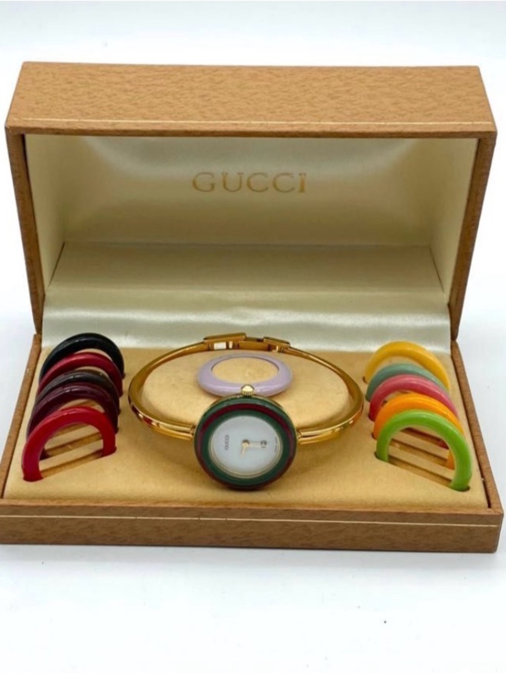Gucci Gold Bangle Watch with Multicolor Interchangeable Bezels